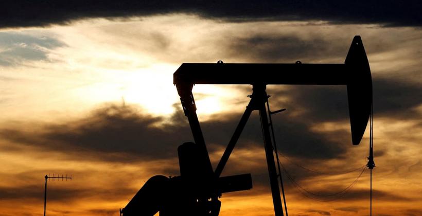 Gold holds near record as oil slips on US Iran talks hopes