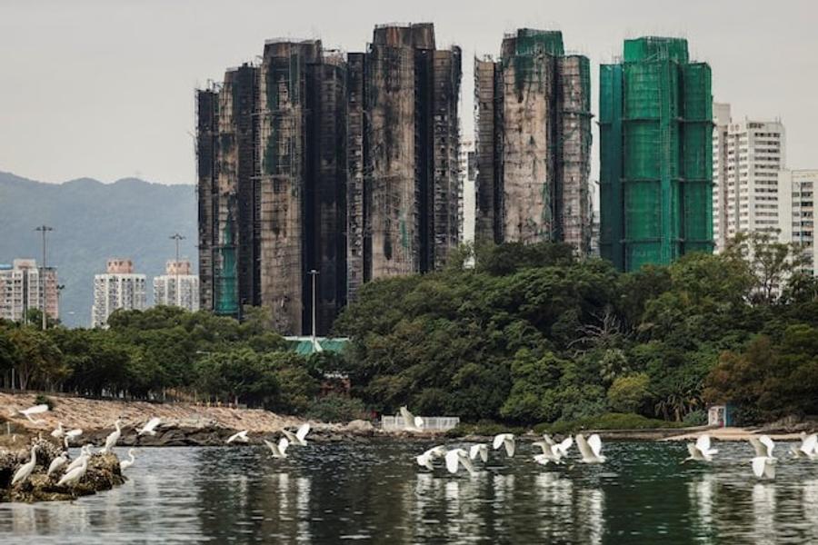 Hong Kong plans buyout of fire-damaged homes after deadly high-rise blaze