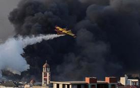 Firefighters battle major industrial blaze near Athens as multiple people are injured