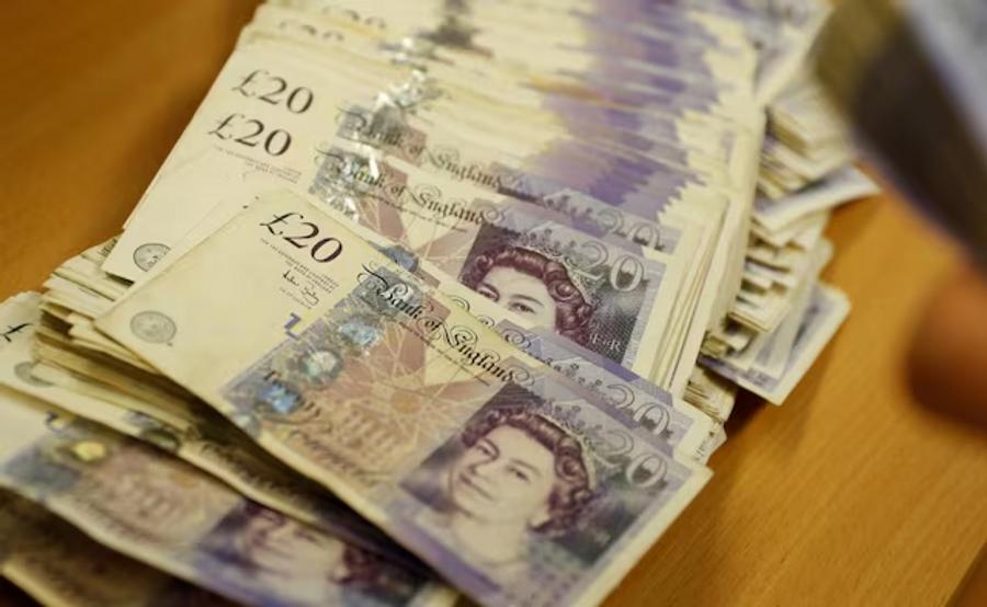 Sterling slips after weak UK jobs data as political uncertainty grows