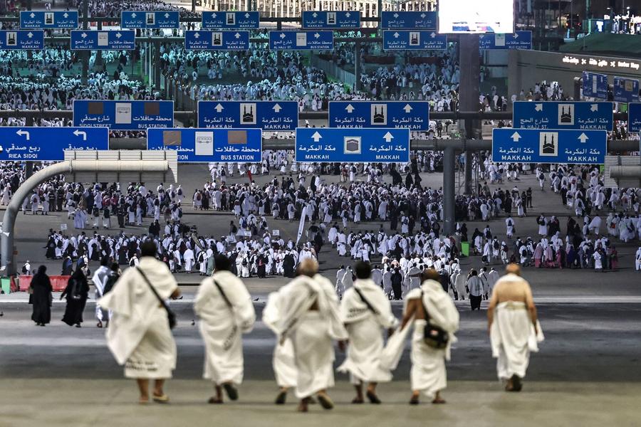Pilgrims Stone Satan near Mecca on the first day of Eid Al-Adha